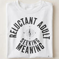 RELUCTANT ADULT SEEKING MEANING | Witty Existential T-shirt - close up