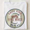RAISE KIDS RIDE BIKES REPEAT | Fun Biker Mom T-shirt - close up