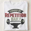 FORGED BY REPETITION DAILY | Motivational Weightlifting T-shirt - close up