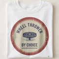 WHEEL THROWER BY CHOICE | Humorous Pottery Life T-Shirt - close up