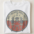 SKELETONS DANCE WHILE I SNACK | Funny Halloween T-Shirt - close up