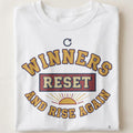 WINNERS RESET AND RISE AGAIN | Resilience Rising T-Shirt - close up