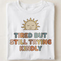 TIRED BUT STILL TRYING KINDLY | Relatable Everyday Humor T-Shirt - close up