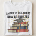 RAISED BY DREAMERS NOW GRADUATED | First Gen Graduate T-shirt - close up