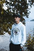 RAISED ON SHUTTLES AND SMASHES | Funny Badminton Hoodie - accurate print preview